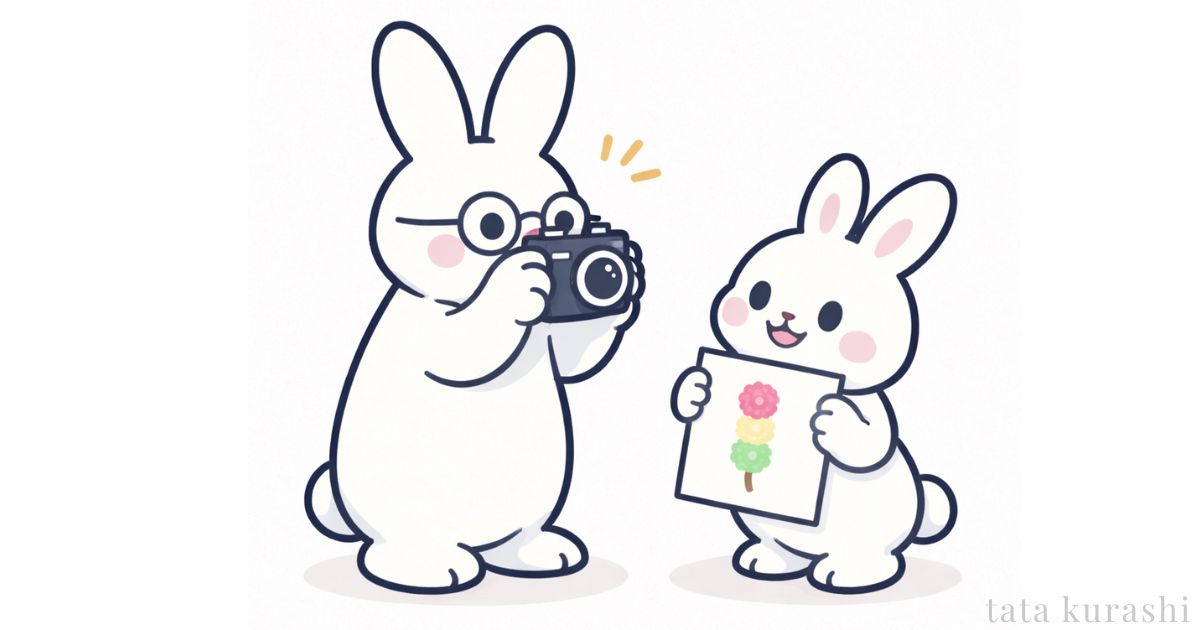 子うさぎが絵をもっているところを撮影している
